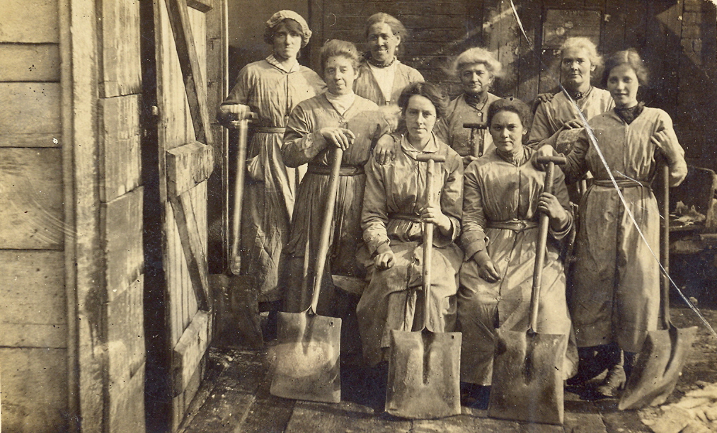 It's looking to be a lovely weekend for a spot of gardening! This postcard is possibly from Middlewich and shows a group of women with shovels.