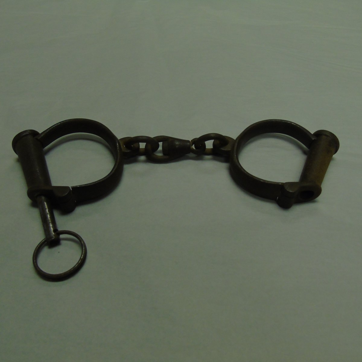 These handcuffs were worn by Dr Hans Hers. Arrested in 1940 while attempting to help a Dutch agent escape to England, he ended up in Sachsenhausen concentration camp working in the infirmary. After the camp’s liberation, Dr Hers stayed to look after the sick for another 4 months