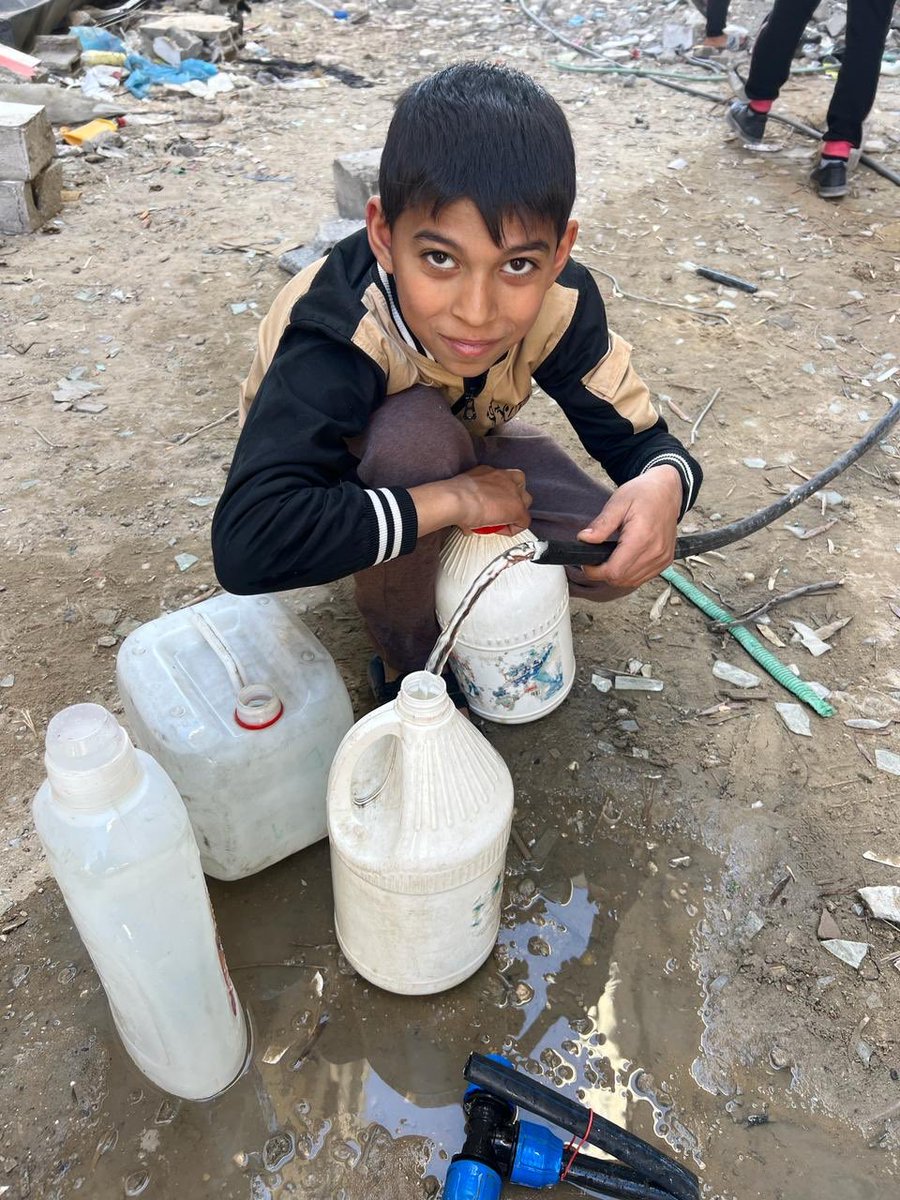 I used to see him carrying water fir his family.. He was KILLED on Thursday.. Just a week ago, his two little brothers were KILLED in #Israeli_drone_attack while carrying water bottles and jars!