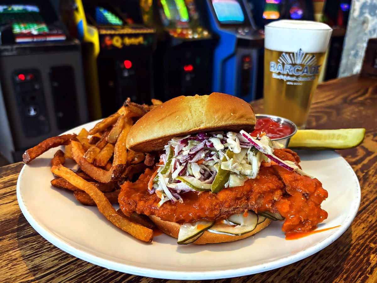 Swing by for our Spicy Buffalo Chicken sandwich special, here in Chelsea! Topped with Gorgonzola dill pickle slaw and house sweet pickles — paired with a glass of @HarpoonBrewery's U.F.O. White!! #Barcade #NYC #Manhattan