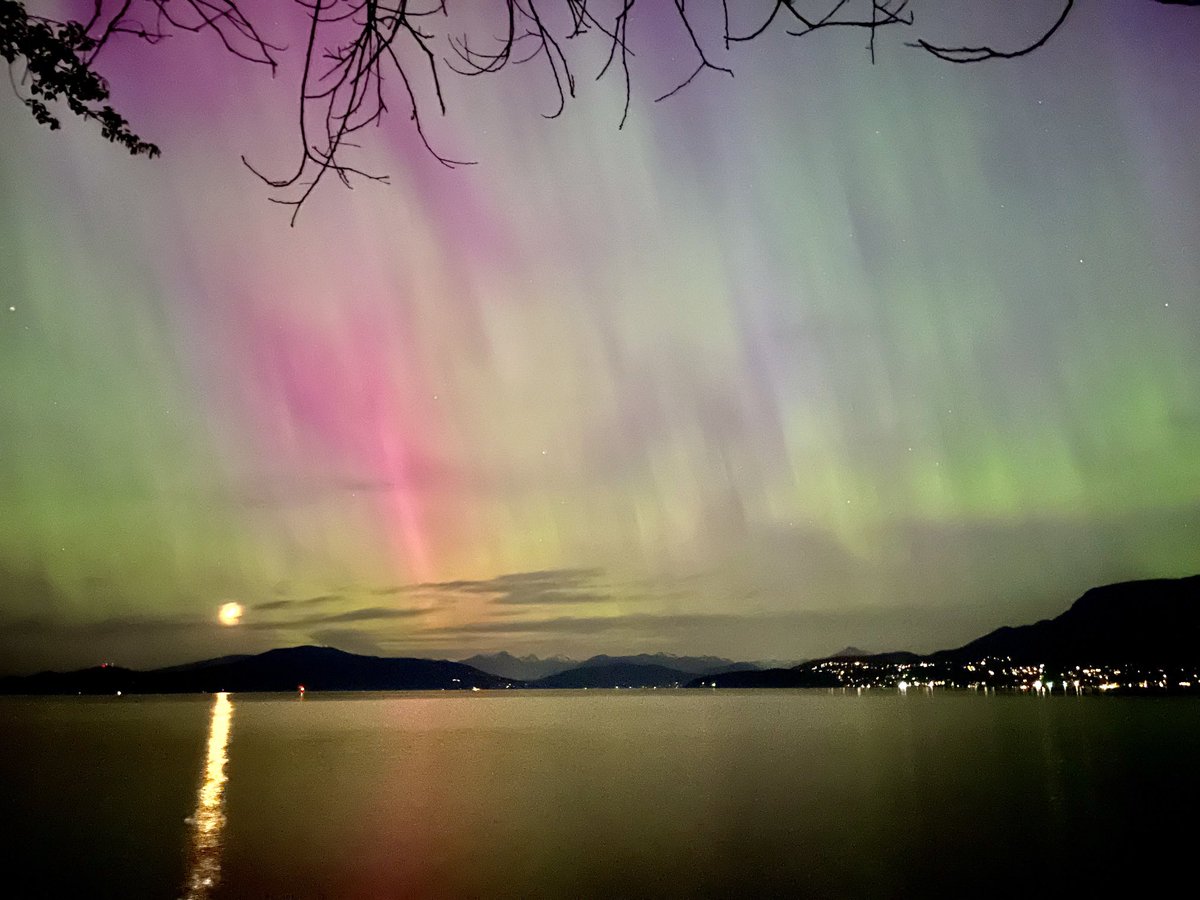 Shot from my #iphone! A once in a lifetime 20-year #aurora in town, with the #moon over the #pacific ocean.  #canada #bc #beautifulbc #thephotohour #stormhour