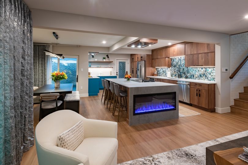 We're celebrating World Baking Day by showcasing this unique kitchen island electric fireplace installation. Who wouldn't want to bake up something delicious in this gorgeous living space? #WorldBakingDay