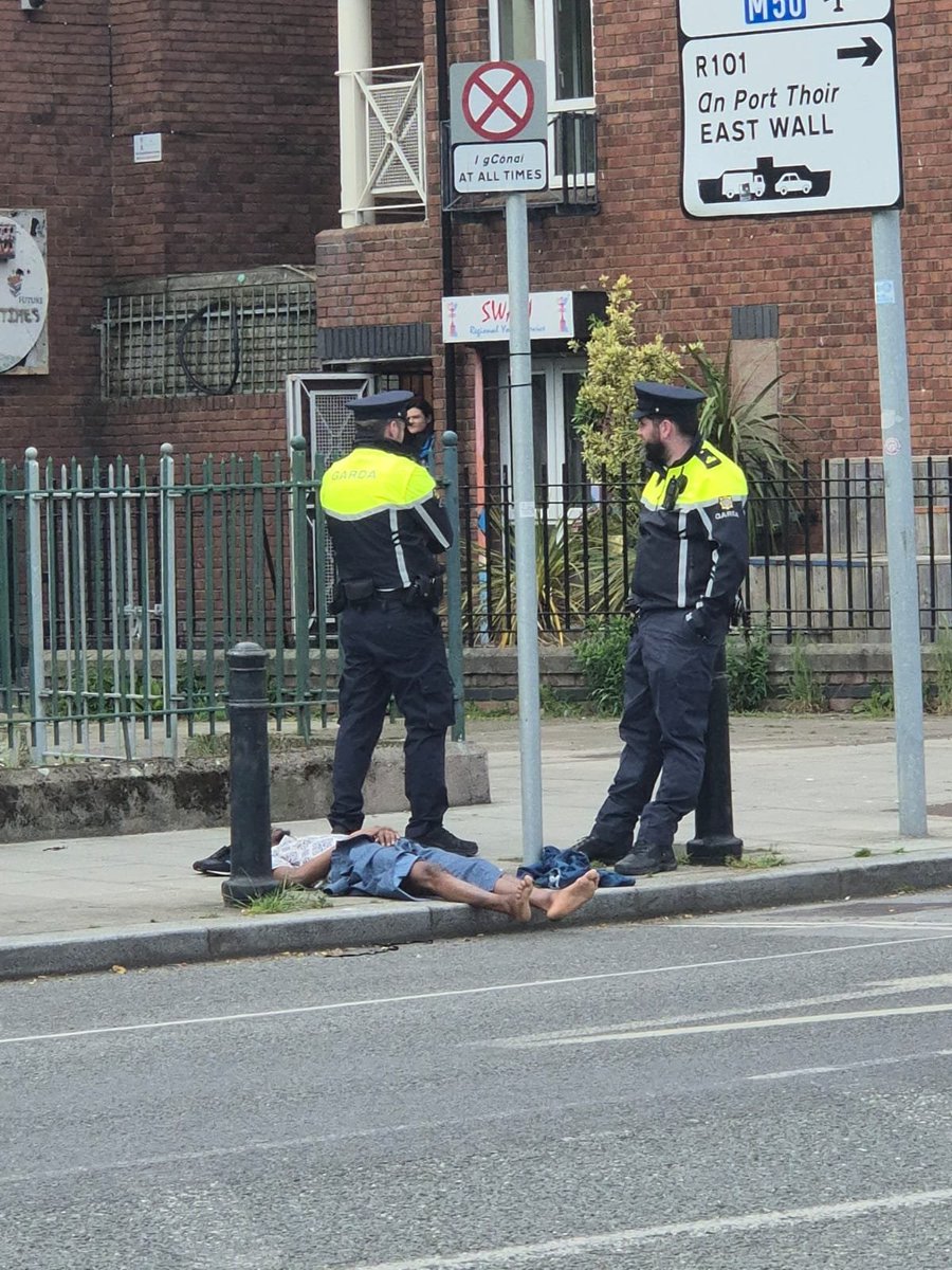 Foreigner outside  the youth club in sheriff street on the ground someone at the door said the kids can't even go outside the country is in tatters everyday this is happening in Ireland #IrelandisFull