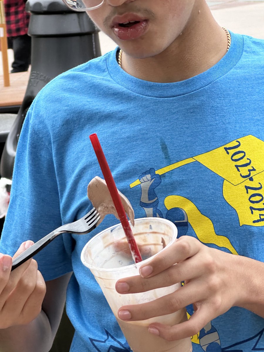 bro is eating ice cream with a fork