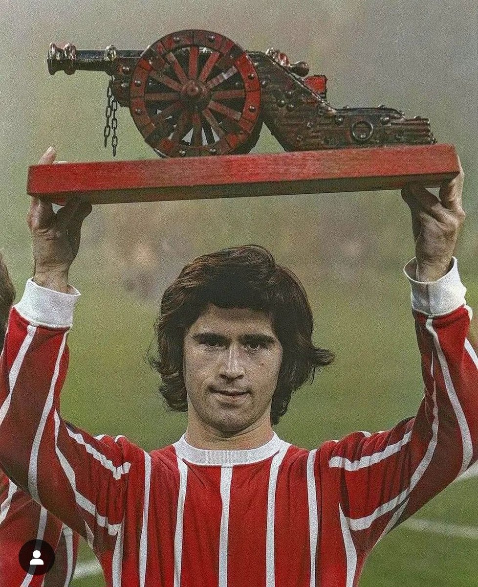 Gerd Muller holds aloft a trophy specially designed for teams that finish 2nd in the English Premier League.