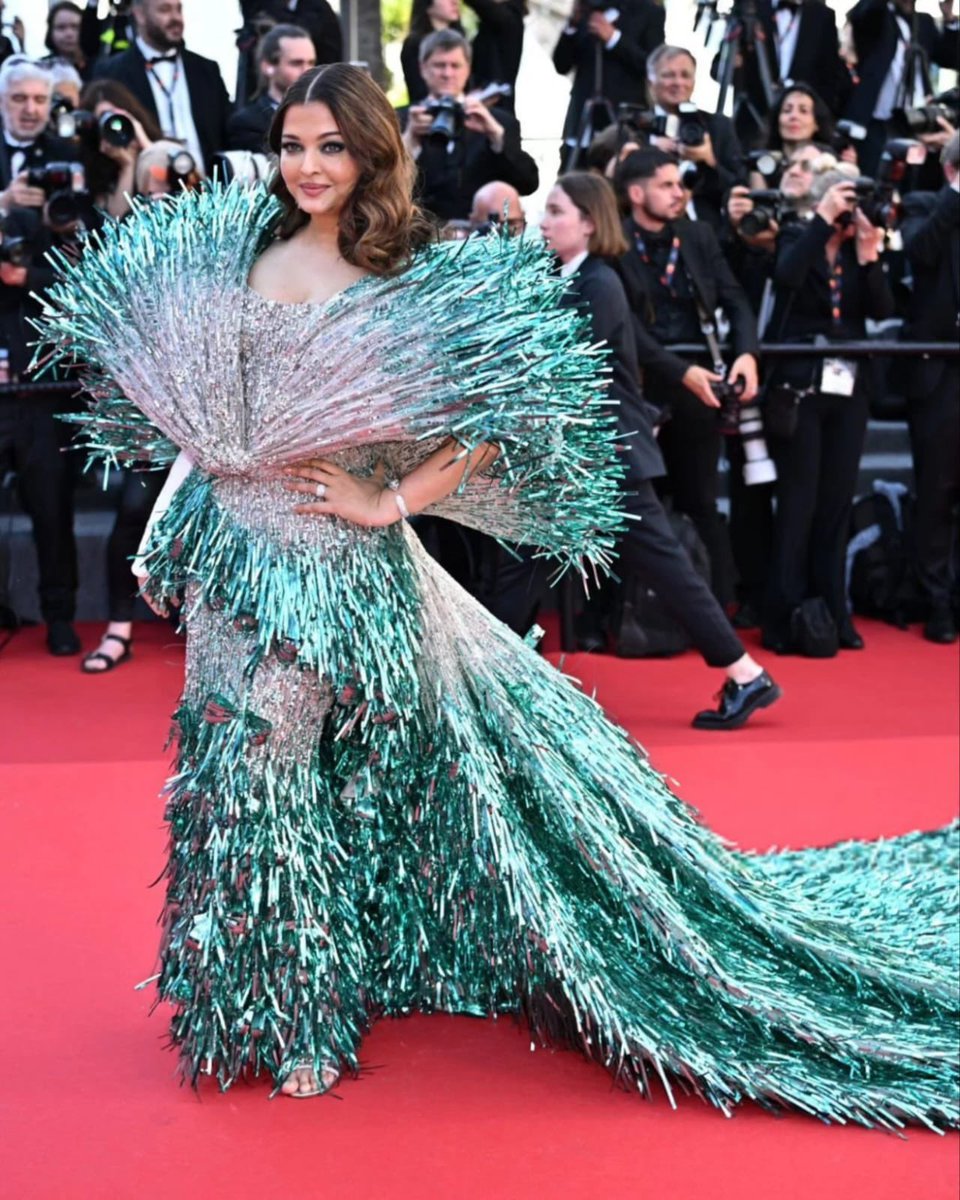 Aishwarya Rai Bachchan walks the red carpet on her second day at Cannes in an extravagant fringe gown with a floor sweeping train