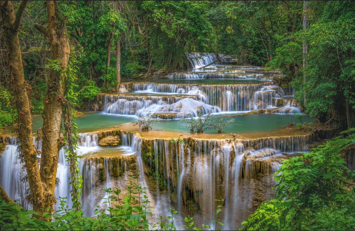 In the jungle at Huay Mae Khamin Waterfall in Kanchanaburi, Thailand. There are 7 levels to explore and it is a less touristy alternative to the popular Erawan Falls