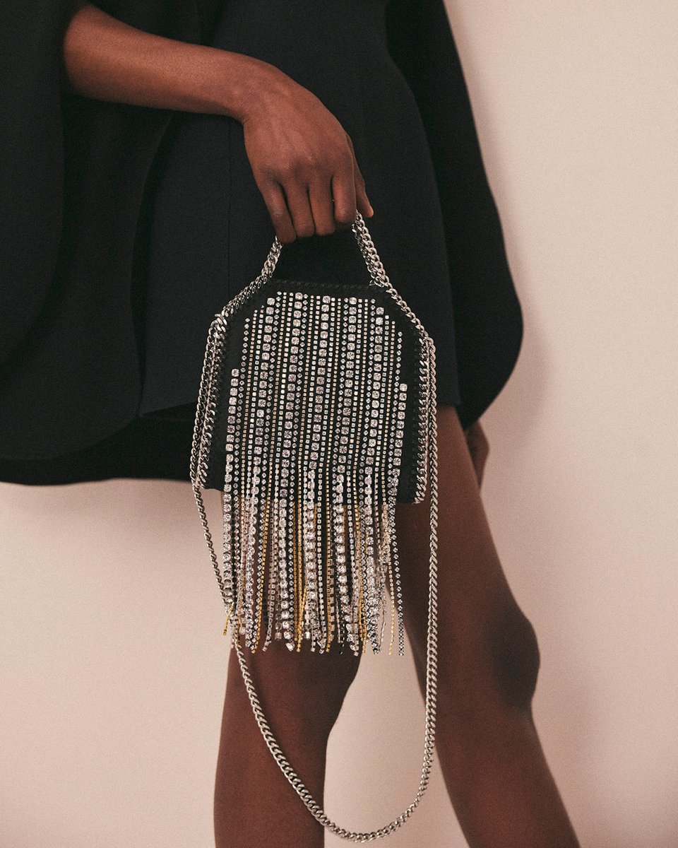 FALABELLA FOREVER: Stella sparkle. Special-edition iconic #Falabella bags glimmer with hand-placed fringes of lead-free crystals. Shop the Crystal Fringe Falabella Tiny Tote Bag in-store and at stellamccartney.com #FalabellaForever #StellaMcCartney