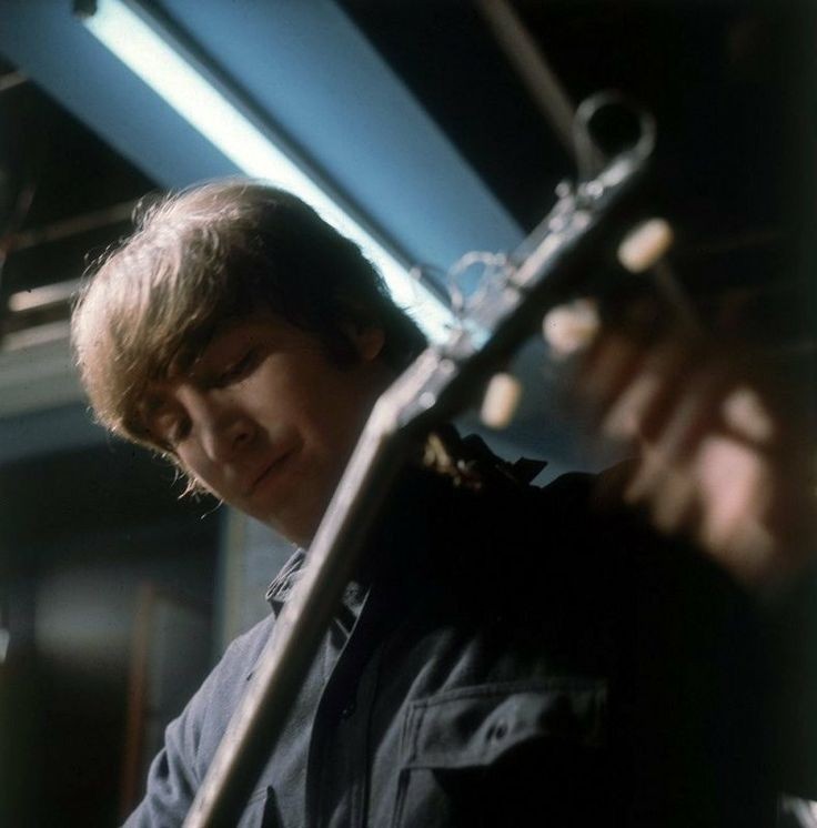 #JohnLennon tuning up on the set of 'Help !', 1965 #TheBeatles