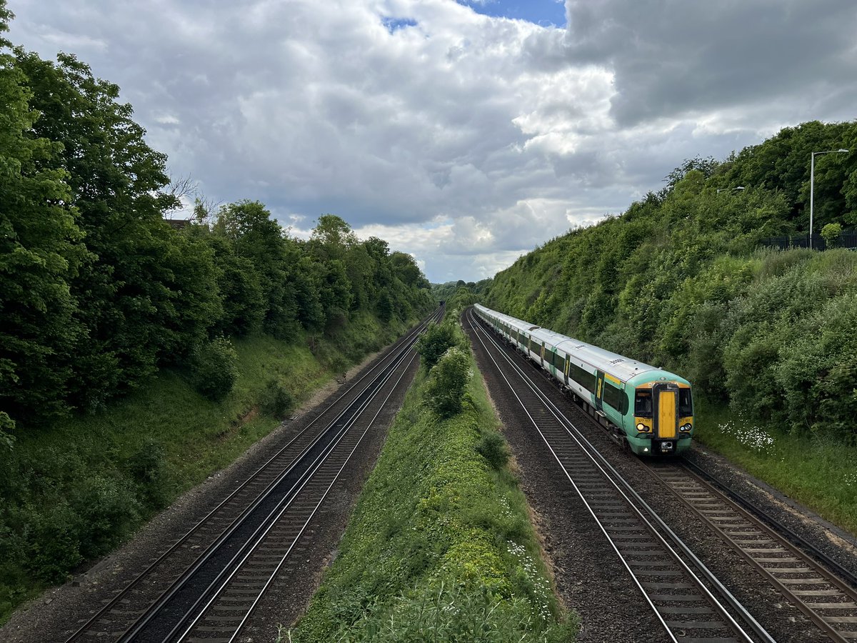 1E43 1533 Eastbourne to London Victoria passing under Woodplace Lane Bridge on 29th May 2024