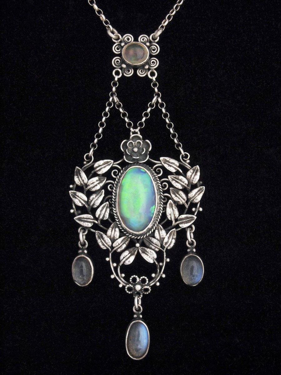 Silver, Opal and Moonstones Pendant, Circa 1915-20.