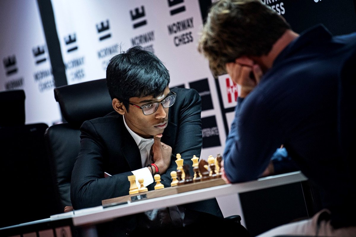 🔥 History made! GM R Praggnanandhaa stuns the chess world by defeating World No. 1 Magnus Carlsen in classical chess for the first time ever! 🏆🇮🇳 At just 18, he's now the sole leader in the prestigious tournament on Carlsen's home turf. A star is born! 🌟♟️ #Chess