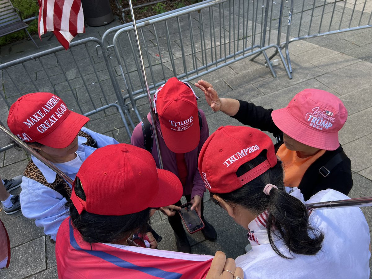 BenBergquam's tweet photo. Tell the mainstream media, this is what #MAGA really looks like. Legal Chinese immigrants praying outside the sham trial in New York City. Praying for real justice for President Trump and for our country! 
@RealAmVoice https://t.co/TqDGsrtKI6
