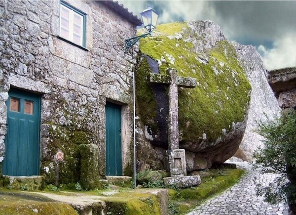 'The Village of Monsanto, Alcains, Portugal.
A historic village in central Portugal is nestled on Monsanto hillock  (Mons Sanctus) and has been occupied since Paleolithic times. It is just built on  top, under, inside and between big boulders.'