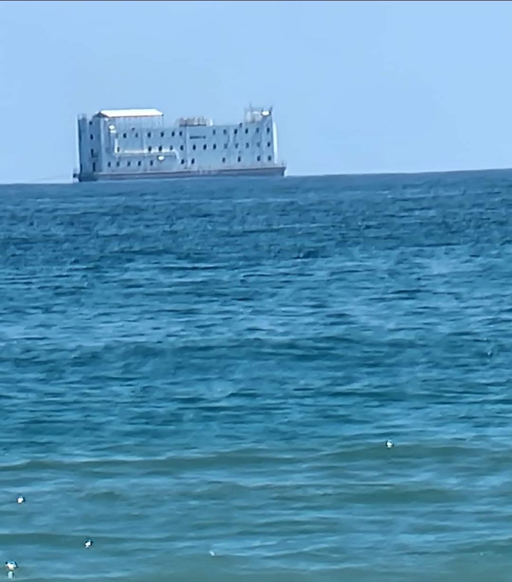 Tugboat was pulling this past Topsail Beach in NC. Anyone else think this looks like a floating prison? Hopefully it is heading to Washington DC. 👊💯