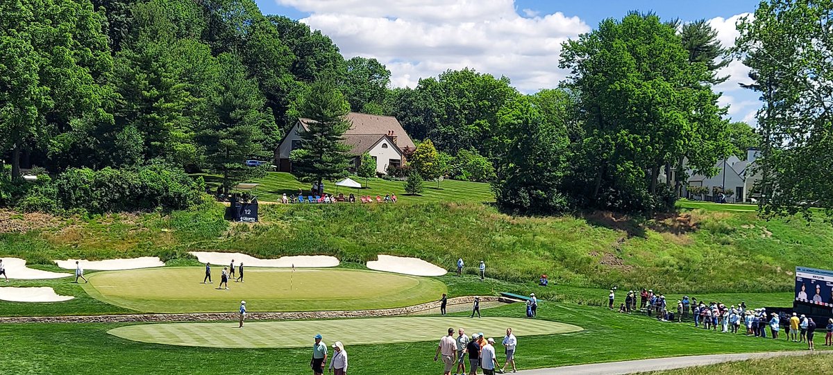 Looking down on the green at the treacherous 12th at LCC. I need to get on the level of those folks in the Adirondack chairs. #USWO