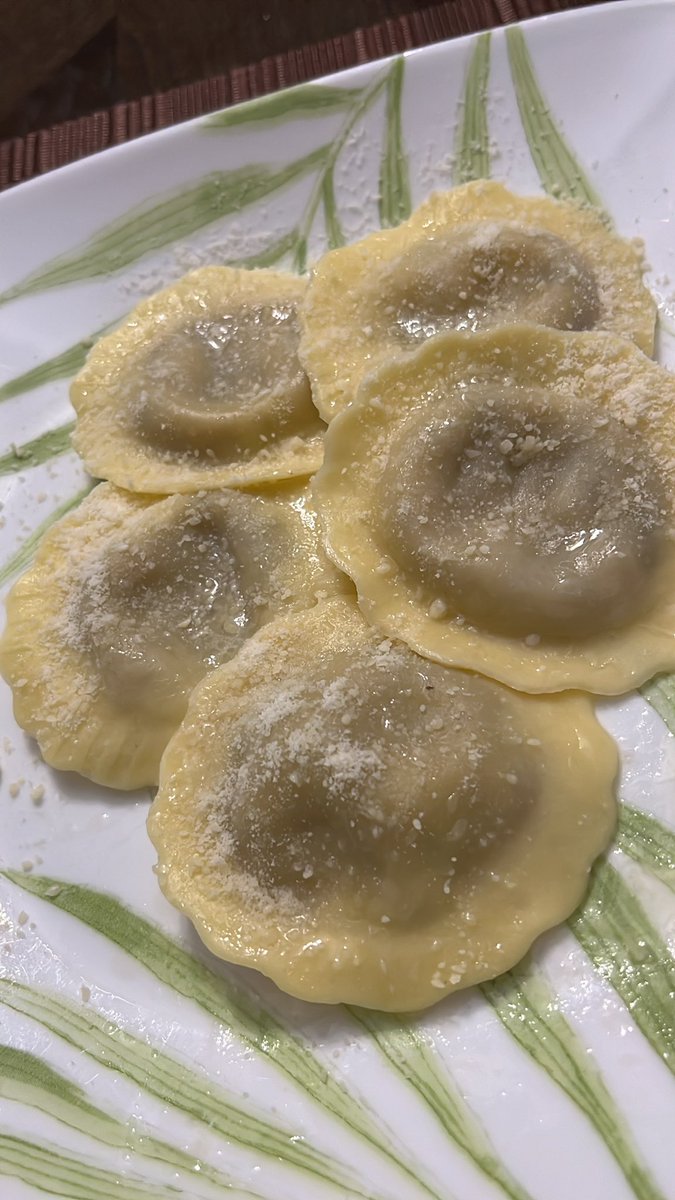 Mushroom Raviolis with light butter sauce , and Parmesan Reggiano cheese.