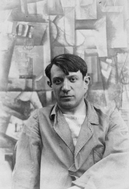 Pablo Picasso in front of his painting 'The Aficionado', in 1912