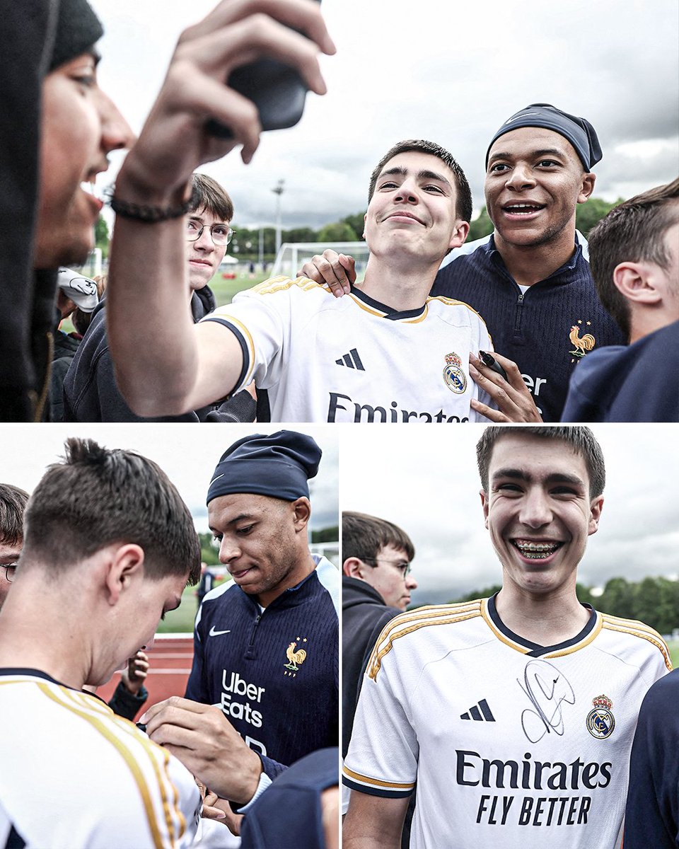 Kylian Mbappe taking pictures with a Real Madrid fan and signing a Madrid shirt during France training 👀