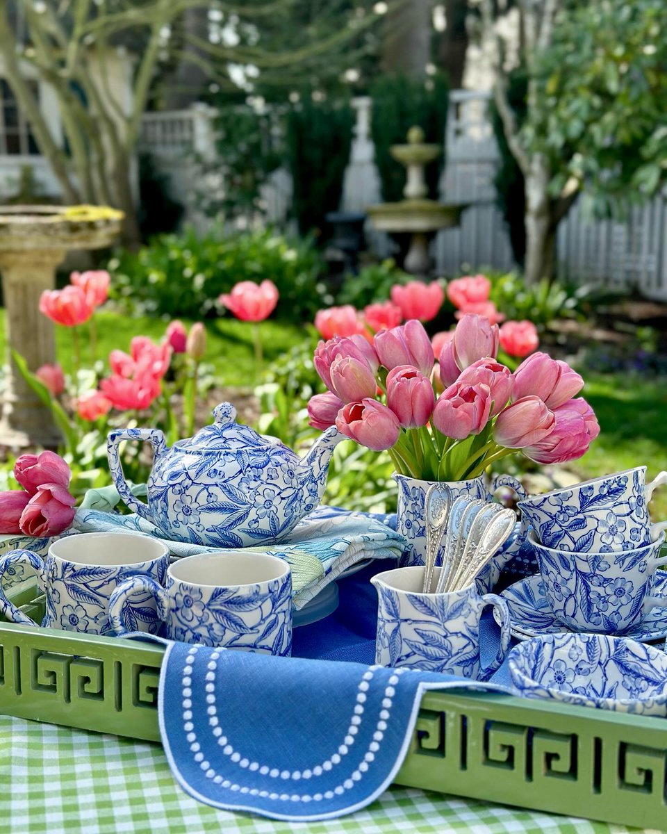 Enjoying an alfresco teatime is a wonderful way to spend a sunny afternoon. Instagram user addictedtochina's welcoming tea, featuring a Burleigh 'Blue Prunus' tea set and pretty pink tulips, perfectly epitomizes the season's joyous sentiment.