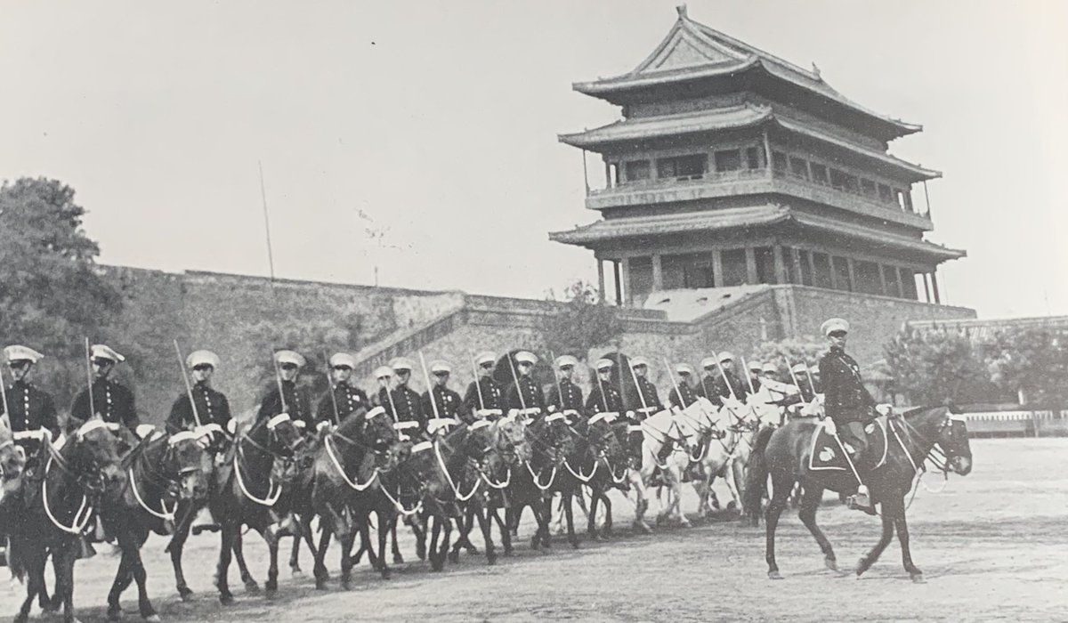 The 36-strong US Horse Marines Embassy Guard, Peking, (1937 & admittedly not the embassy then but still so-named) & their Mongolian ponies parade by the Tartar City Wall. Photo by Gilbert Grosvenor