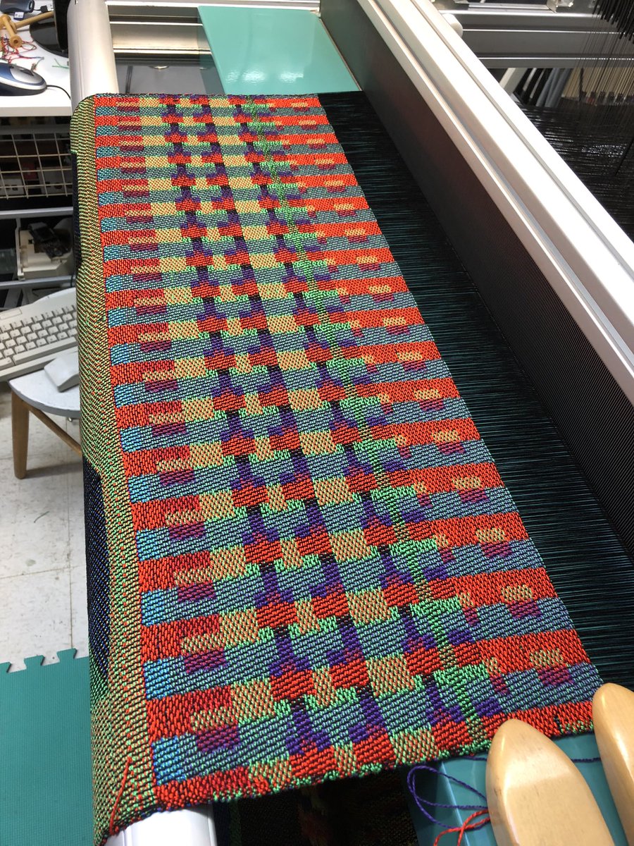 Designed using Paint for Atari 8 bit computers from 1982. Woven on a hand operated/computer assisted Jacquard loom.