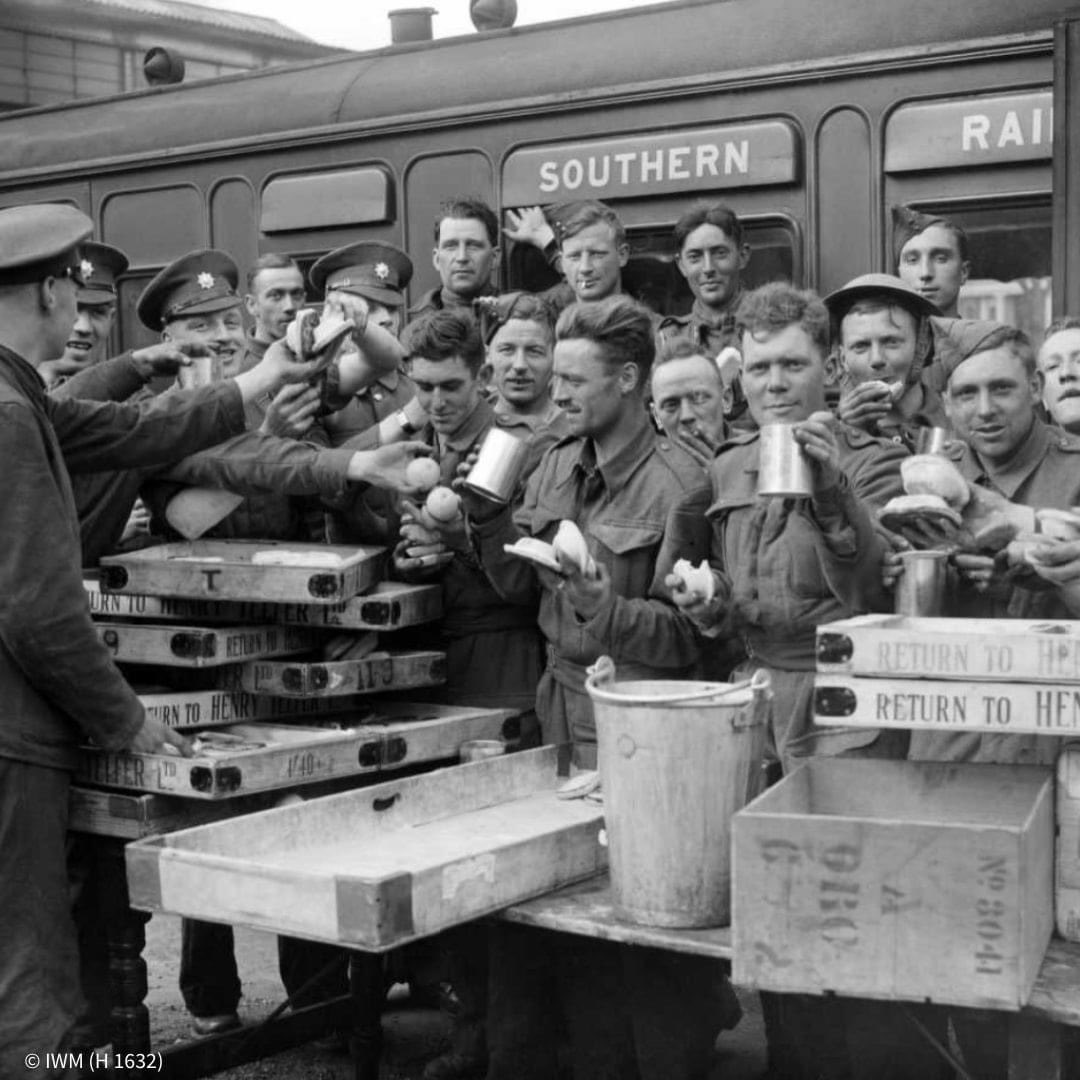 Troops evacuated from Dunkirk enjoying a mug of tea at Addison Road Station in London (May 1940)