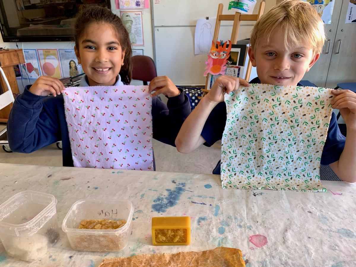 SJPSMitcham's tweet photo. Our Junior students were buzzing with excitement as they explored the wonders of bees, including honey, wax, and honeycomb. During this special incursion, each Year P-4 student made a beeswax wrap to take home and use in their lunchbox, helping to eliminate cling wrap. https://t.co/j8mFpnTy87