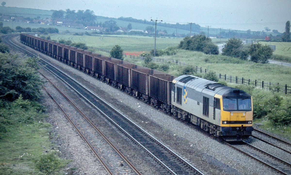 60049 ‘Scafell’ in Railfreight Metals colours provides a little Mirlees power at the head of the Scunthorpe iron ore service. Previously in the hands of 37s, the move to the class 60 was a natural progression. 
#Class60 #Tug #RailfreightMetals #IronOre #Trainspotting