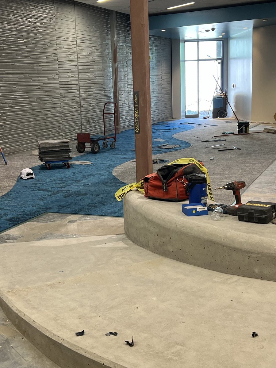 Construction update/pictures of the new Nashua 🚧 🦺 🏗️ Grand staircase is close to completion Final paint throughout the building Carpet installation in the library Curbing and concrete at the front of the building @NKCSchools