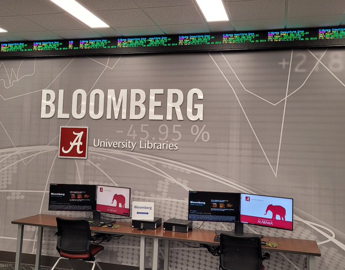 Bruno Library photo of Bloomberg Terminals showing stock tickers and computer monitors