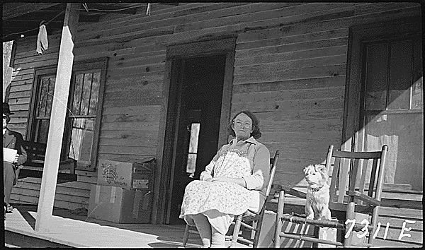 This <a href="/TVAnews/">Tennessee Valley Authority</a> photo right here is a perfect example of dogs being man's (and woman's) best friend! We would love to have one rocking chair for us and one for the dog.

#ArchivesPets #ArchivesHashtagParty

"Eliza Rose, sitting on front porch, 1938" - catalog.archives.gov/id/280784