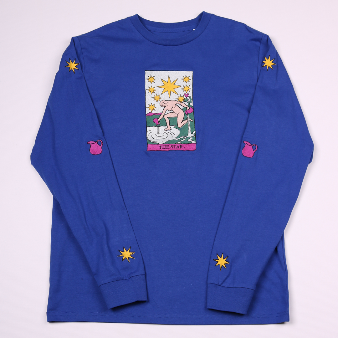 I absolutely love this idea! I love the asethetic of tarot cards so was thrilled when a customer asked me to embroider them on to t-shirts for her and a friend. My customer also requested the addition of the stars and and jugs to the sleeves which is such a lovely detail