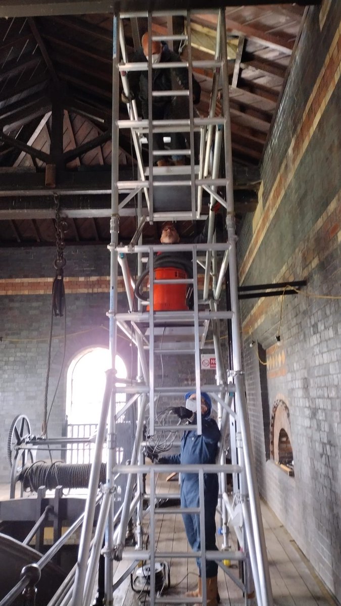 At #SandfieldsPumpingStation we have started the lighting project in 1873 building.  Step 1 remove old lights that were used as nests by pigeons - so hoover going up the scaffolding!  🙄#BoostLichfield #LichfieldCity