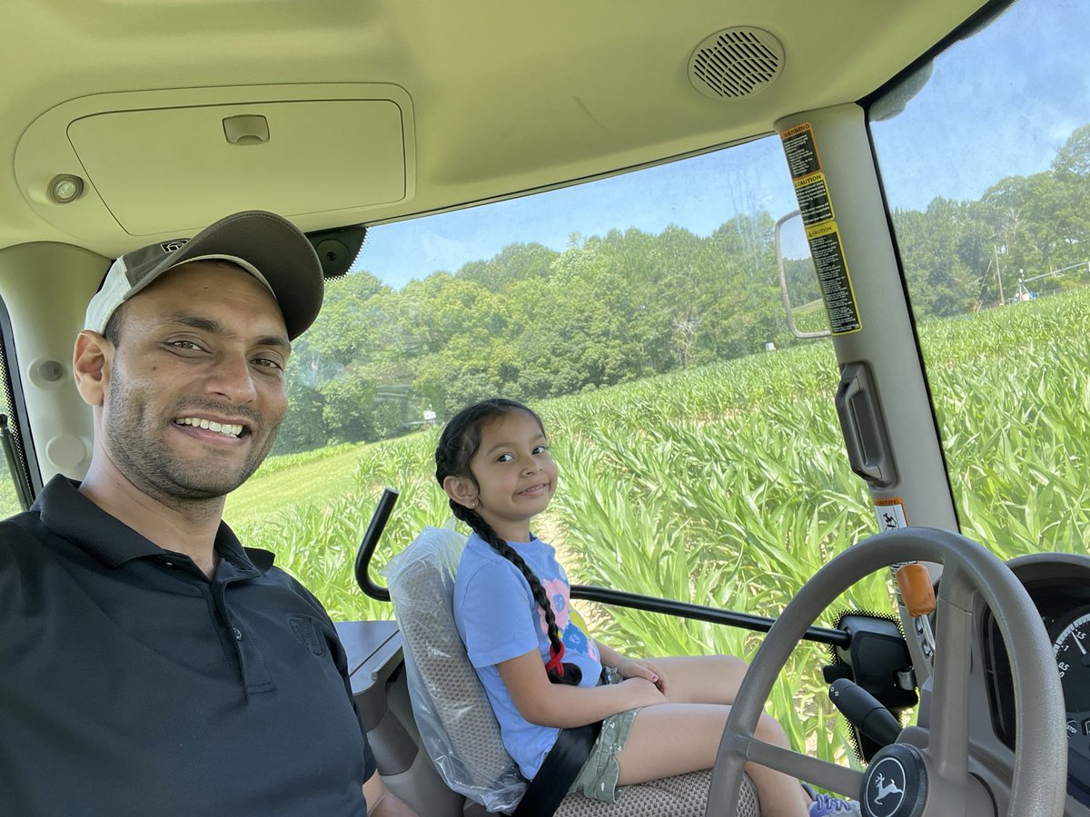 PrecAgEngineer's tweet photo. School is out so my summer help is back. Checking crops and cutting alleys in plots with my little helper today!! #ugatifton #research24 https://t.co/Bx3PmGOGPR