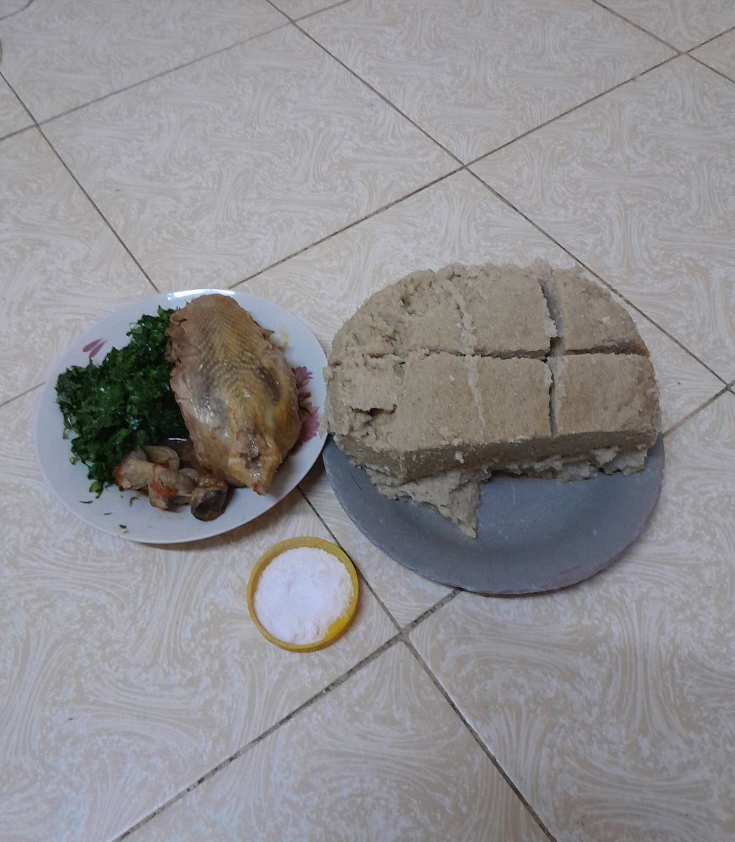 Chicken meat, kales, and ugali for supper