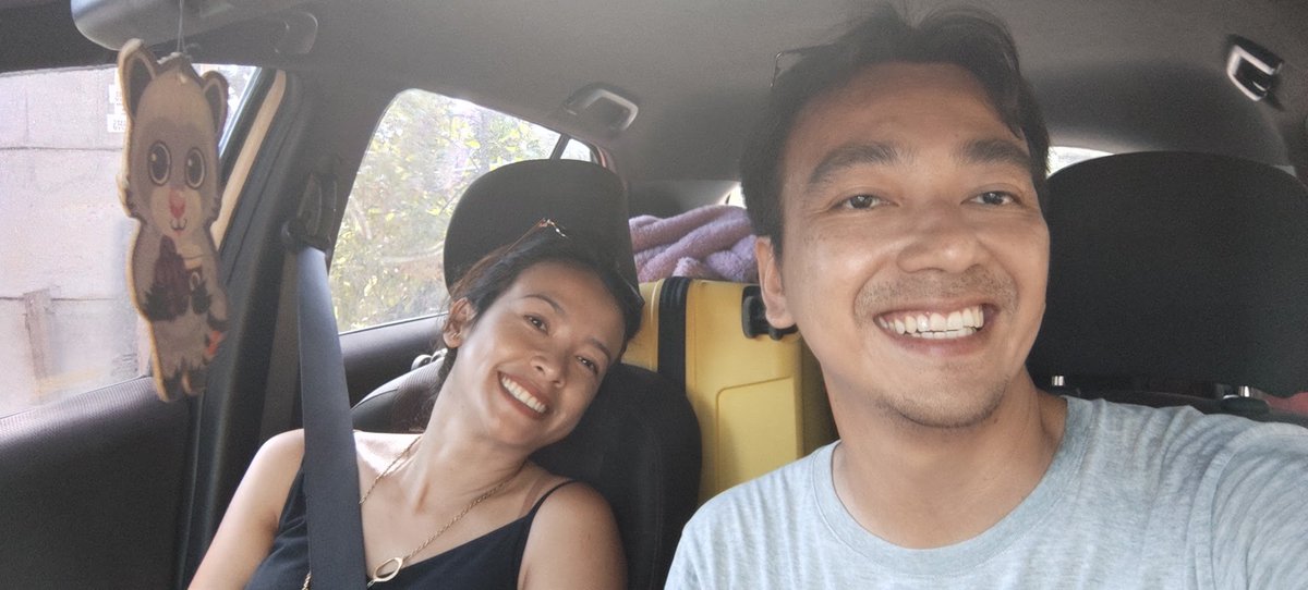 TalkinAndy's tweet photo. Tepat sebulan tinggal di Lombok -- tepatnya Kuta Mandalika (moving from BSD); and here's a short review:

The Air
Tentunya udara bersih dengan AQI satu digit saja. Walaupun di pinggir laut, tapi hawanya ngga ada lengket2nya, ga kayak di PIK atau anywhere di Jakarta Utara ifywim.

Matahari kadang terik, tapi somehow udara ngga humid jadi asal di tempat teduh asal berangin, gw merasa ga butuh AC. 

Nah, minusnya itu masih banyak yang suka bakar sampah gitu -- but well nothing is perfect.

Acommodation
Hunian (rumah yang disewakan/villa) itu relatively lebih mahal. Ini karena supply masih terbatas dan ya emang harga turis.
Monthly rent cost gw sekarang lebih mahal dibanding waktu di Branz BSD, with less facility.

Food
Kalau yang dicari makanan populer dari perspektif Jakartans seperti bakso, ricebowl, mie, ayam goreng tepung, nasi goreng, dll -- yamasih sangat terbatas opsinya. 

We don't even have KFC, McD or any popular brands. Ngga ada juga go/grab-food di sini. 

Kalau mau yang begituan ya harus jalan ke Mataram (1 hour driving)

Jajan paling populer adalah crepes, atau artisan gelatto (kaga ada Mixue ya)

Sehari-hari gw belanja sayur, ikan, udang di pasar kalau pengen masak. Belanja pagi masak hari itu juga, all fresh.

Kalau males masak ya ada bbrp warung prasmanan yang style-nya ya home made Indonesian food.

Transport
Harus pakai kendaraan pribadi -- ngga ada ojol di sini. Gw sewa motor bulanan yang gw pake kemana-mana. 

Gw masih nunggu onewheel dikirim dari Jakarta buat strolling di pinggir pantai btw. 

Scenery
Lombok is effortlessly beautiful.

Banyak banget spot pantai yang belum gw kunjungi dan kegiatan2 yang belum sempet gw lakukan kayak:
- Paragliding/Sky lancing
- Spearfishing
- Kite surfing

Belum juga menjelajah area pegunungan di kaki Rinjani kayak di daerah Sembalun dan sekitarnya.

Karena niat gw pindah bukannya "vacation" tapi long term stay ya ngga keburu-buru sih. 

Hospitality
I mentioned before, gw ga pernah berasa mendapat diskriminasi dibanding foreigners. 

Tapi memang secara standard hospitality, somehow berasa masih belum sebagus di Bali misalnya. 

Hal-hal kecil misalnya cleaning schedule villa gitu kadang ngga jelas; handuk kelupaan, dll. 

Dan juga, di jalan Kuta ini masih banyak anak2 kecil yang jualan gelang dengan metode rada maksa dan memang di "pekerjakan" orang tuanya; dan ini lumayan mengganggu kenyamanan kalau lagi makan gitu.

Kapan itu lagi beli crepes juga ada bule yang dikerubungin anak-anak kecil diminta beliin mereka crepes gitu (kayaknya gara-gara dia beliin satu anak trus lainnya pada ngikut)

Not that it's a big deal, tapi penting buat set expectation right; apalagi yang niatnya misal "vacation in fancy island place" gitu. 

Some notes
Mungkin orang melihat gw doing "permanent vacation" gitu but really I'm just trying to balance work-life. 

Sudah beberapa tahun terakhir gw selalu mencoba conscious untuk menghindar business opportunity yang membuat gw "geographically locked somewhere".

And there's always trade-off in this. My wife and I are always comfortable with some degree of uncertainty; yang mungkin buat bbrp orang lumayan ekstrim seperti pertanyaan "minggu depan kita tinggal di mana ya?"

Btw gw rencana tinggal sampai akhir tahun, tapi pindah kesini cuman book villa buat sebulan doang. Ketemu tempat tinggal for the rest of the year ya baru dapetnya seminggu yang lalu :D

Foto pindahan pinjem mobil warlok:

Di twit gw lain gw ada komentar kalau tinggal di Singapore "terlalu teratur, kurang chaos" -- and I think what I mean is this:

When your life goal is already past "survival" stage; then gw melihat ada spektrum begini: 

Bosan -- Nyaman -- Seru -- Menderita

Too much predictability; bakal ada di spektrum paling kiri. 

Too much uncertainty; you'll end up di paling kanan.

The goal is just to swing between "Nyaman" dan "Seru".

FIN