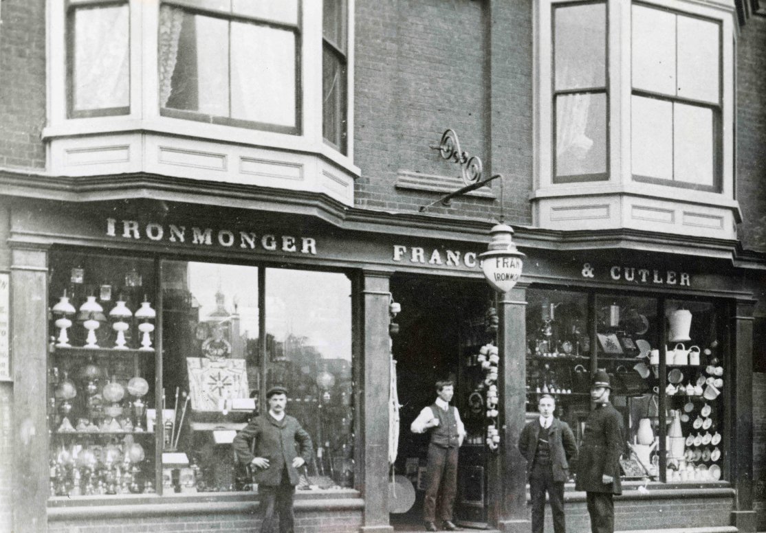 Francis and Cutler's ironmonger's shop in Church Street, #Cromer; a policeman is standing outside the shop; note the new and improved lamp over the entrance. Taken about 1900.
