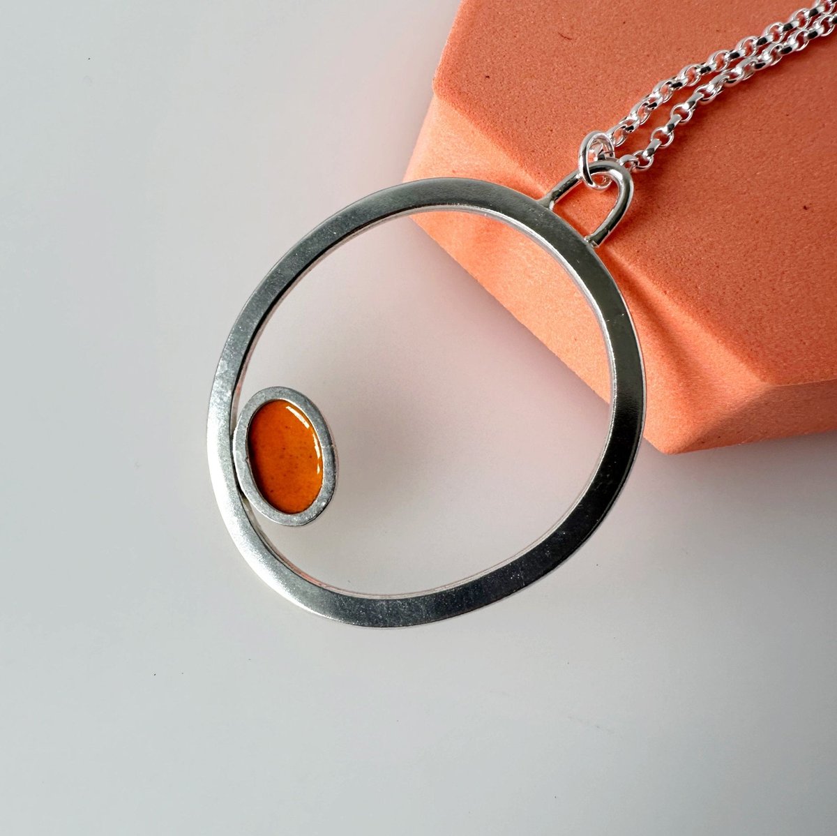 Silver Circle Pendant with Enamelled Oval in Orange tuppu.net/8dba804b #HandmadeHour #inbizhour #giftideas #MHHSBD ##UKGiftHour #shopsmall #UKHashtags #bizbubble #Orange