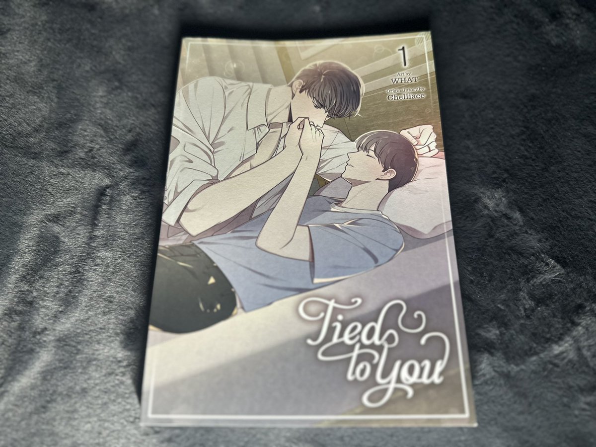 'Tied to You' is a captivating manga that delves into the complexities of love and destiny. Shin Wooseo, a young man, discovers that a red ring magically binds him to his soulmate, compelling them to sleep only in each other's presence. This whimsical twist on the 'red string of