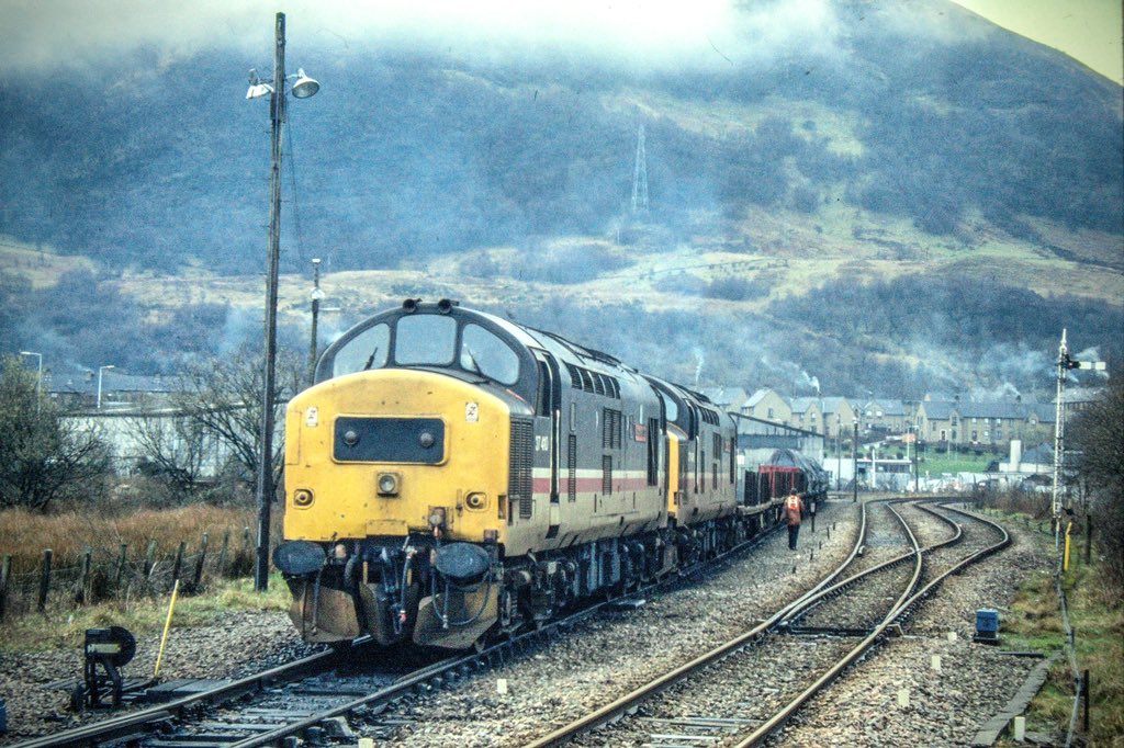 An image that brings back so many memories. The sights, sounds, and smells of a pair of 37s preparing their freight consist in the yard at Fort William. The weathers drab, but who cares! 37410 ‘Aluminium 100’ looks great! 
#Class37 #Tractor #FortWilliam #BritishRail #WHL