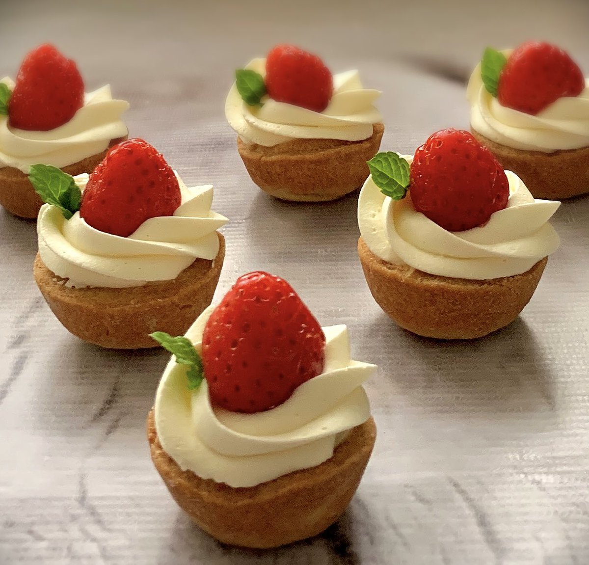 Bite sized strawberry tarts … filled with creme patisserie and chantilly cream 🍓🍓🍓