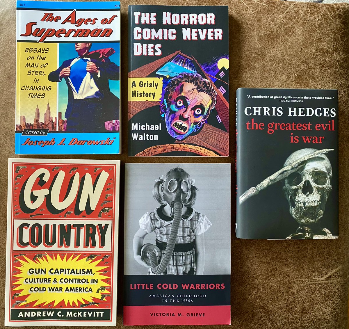 Next 5 down on the pro reading list. Prepping for next year's Cold War comics class w/ @JDarowski. Grieve is solid on politically mobilizing kids. @ChrisLynnHedges assails the 'pimps of war.' And @drewmckevitt is stellar! One of the very best reads this year. @UNC_Press is 🔥!