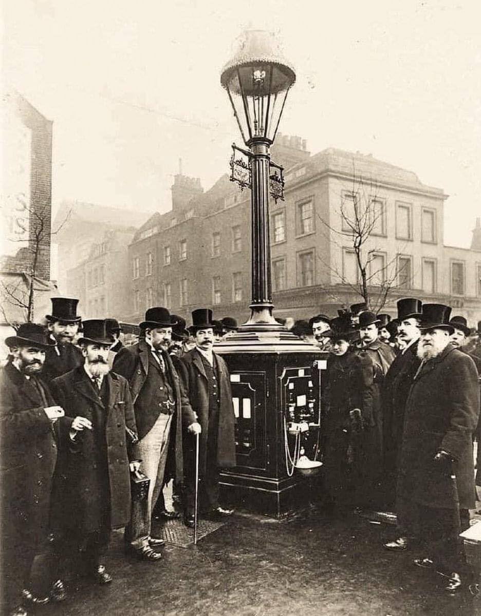 Pluto Lamps were first demonstrated in 1897. They included an automatic machine that could dispense a gallon of hot water, or a halfpenny worth of beef tea essence, cocoa, milk, sugar, tea or coffee.

Pictured here is the inauguration of the first Pluto lamp in Exmouth Street