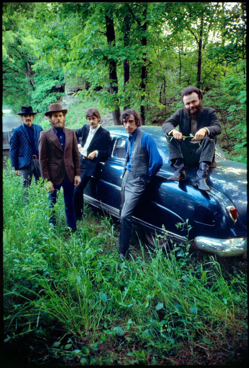 The Band posing for Elliott Landy with Rick's Hudson, Woodstock, 1969.