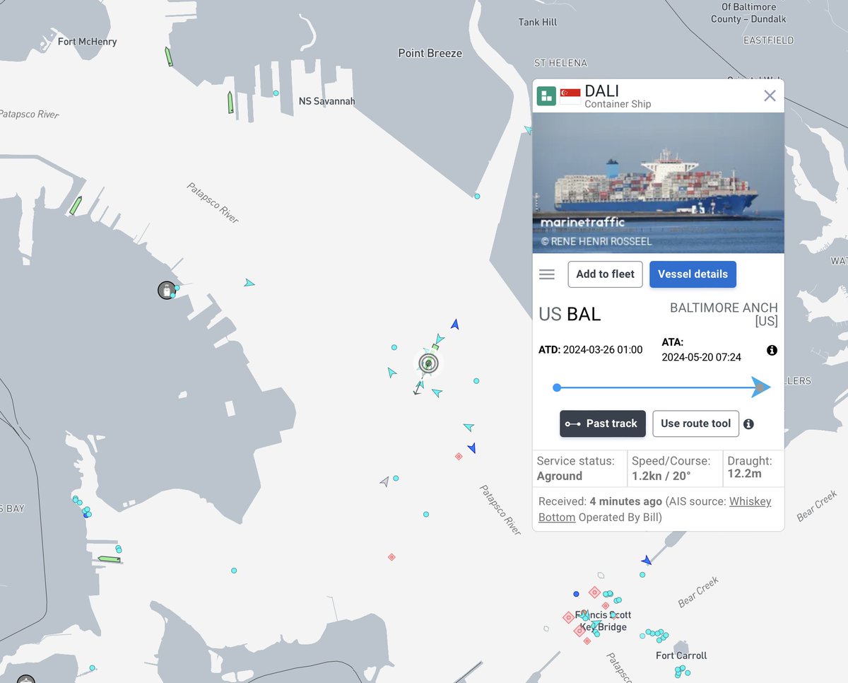 Tug boats are positioning the DALI for docking at SeaGrit Terminal in Baltimore.