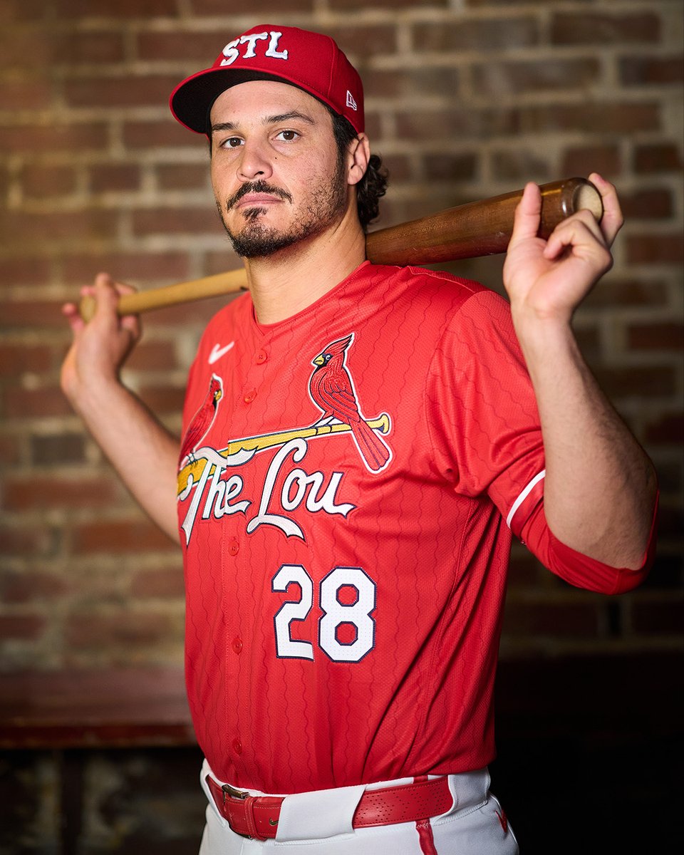Nolan Arenado wearing the Cardinals' City Connect uniform. He's holding a bat across his shoulders.