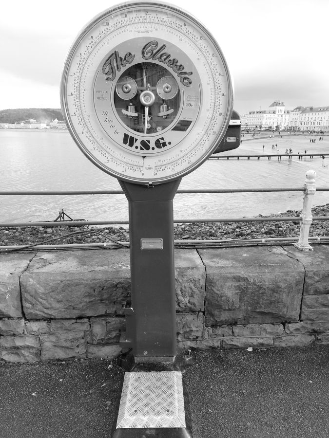 LLANDUDNO. On the Pier, wiegh youself going on, weigh yourself coming off, see how many doughnuts/candyfloss/chips you've eaten. #Llandudno #LlandudnoPier #weight #blackandwhitephotography