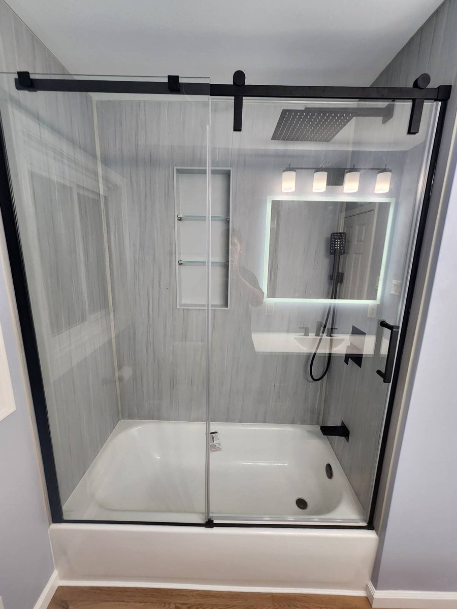 We love this transformation, put in a tub but got to keep the elegance of sliding glass doors, and do you see those shower heads! 😍 #RenovationsNow ✅

#homeimprovement #bathroomdesign #style #macombcounty #dreambathroom