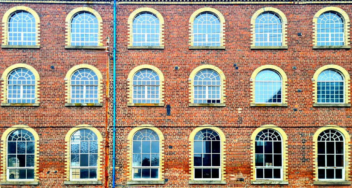 Polychromatic brickwork on a former industrial building on Portman Street in the Kinning Park area of Glasgow. #glasgow #architecture #glasgowbuildings #kinningpark #windows #brick